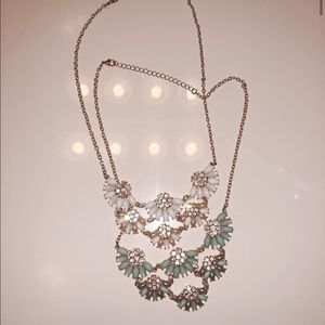 Floral necklaces both with gold chain